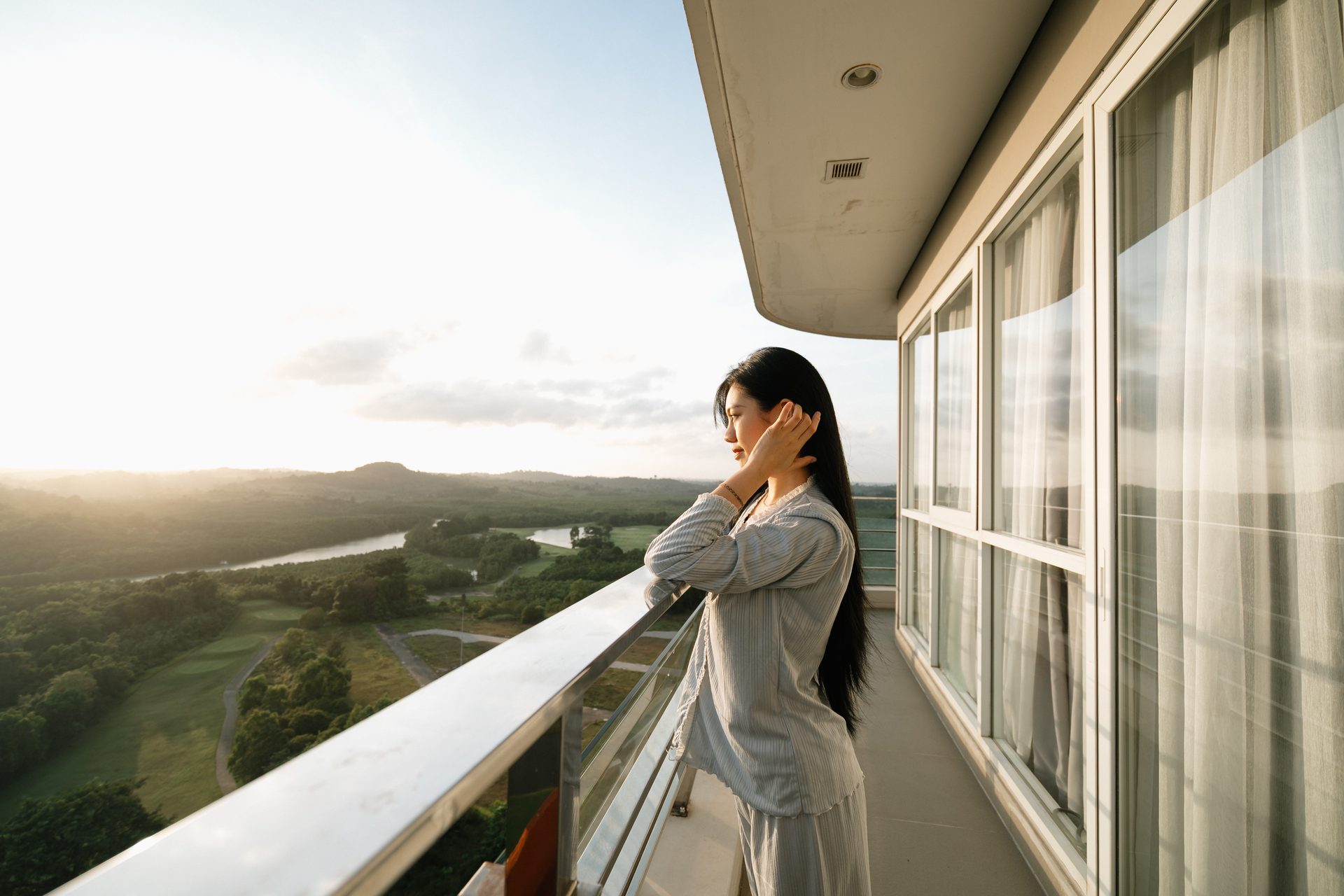 Kalani Tower Batam balcony at sunset overlooking the Palm Springs golf course