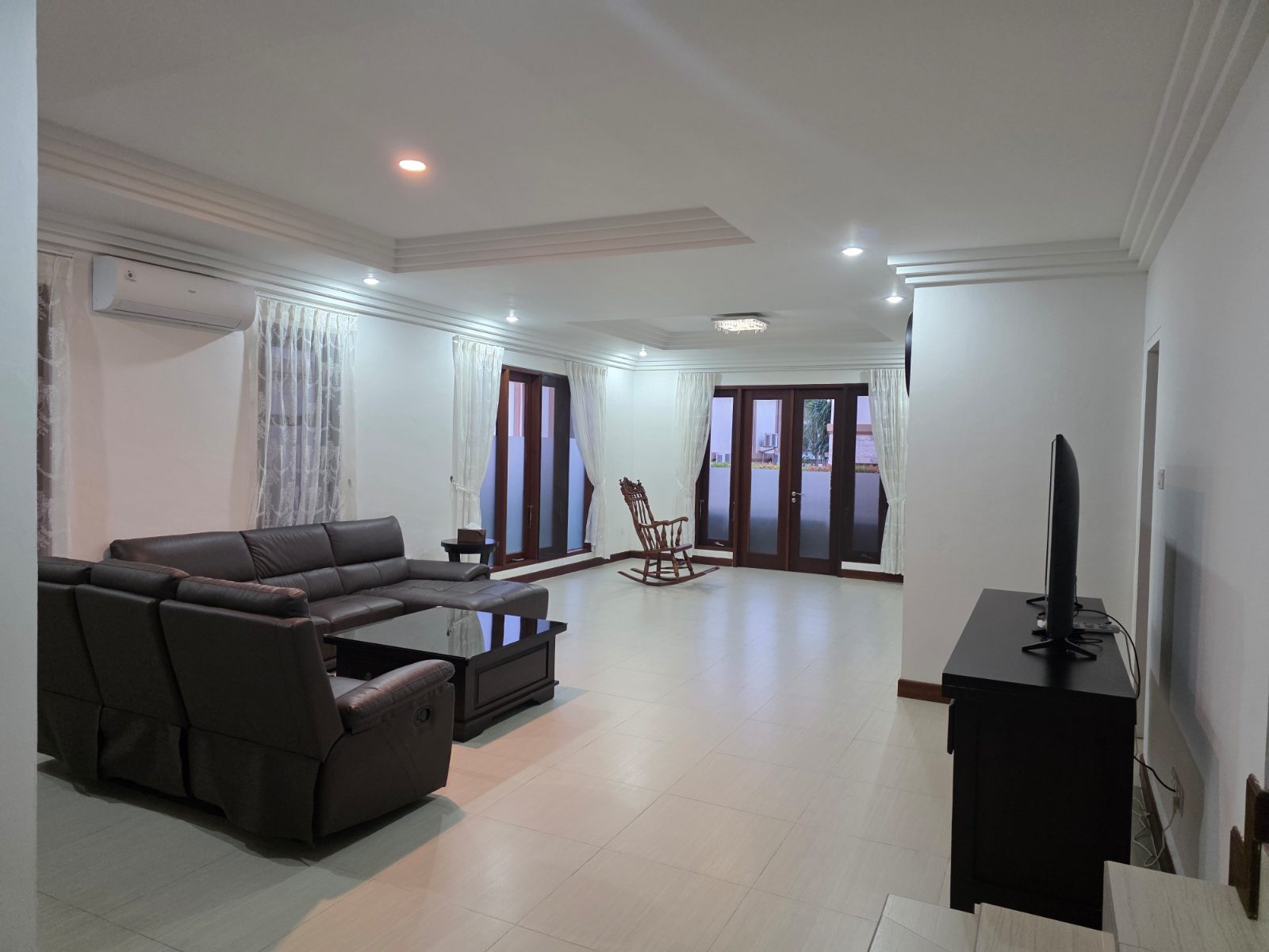 Villa Panbil Batam living room with sofas and TV